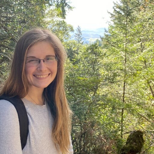 Rachel headshot in the woods