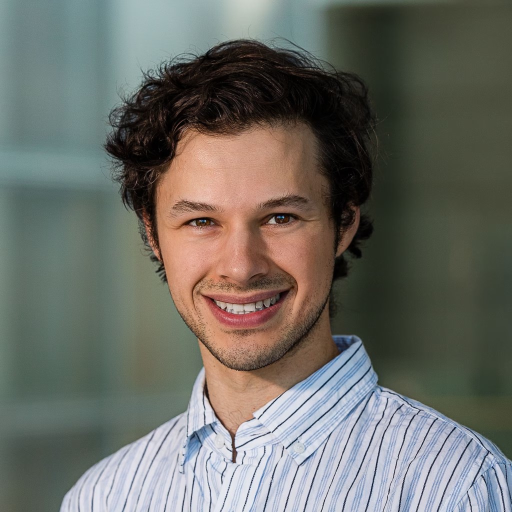 Soucy headshot in blue and white business shirt